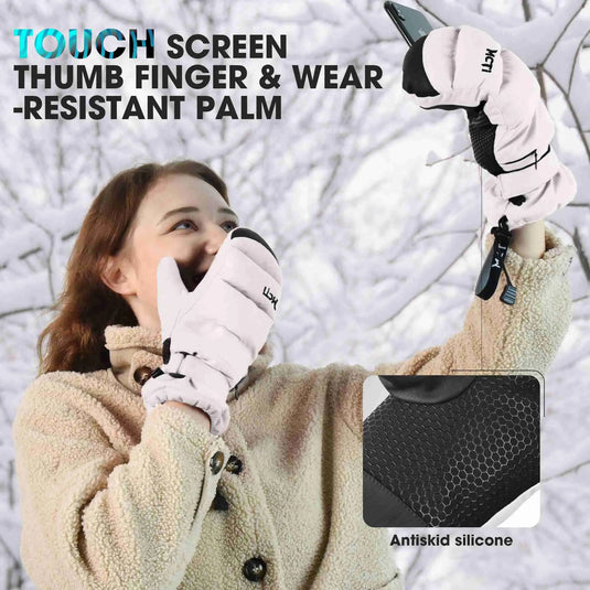 Woman wearing white Quilted Style Mittens in winter snow, showcasing touch screen function for capturing scenery.